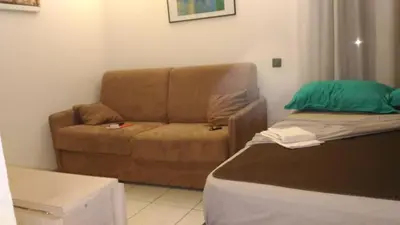 a living room with a couch and a chair at Californie Appartement in Nice