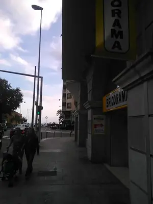 a group of people walking down a sidewalk near a street at Californie Appartement in Nice