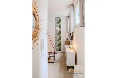 a room with white walls and a hallway with a desk at Nice Centre studio proche Promenade Des Anglais in Nice
