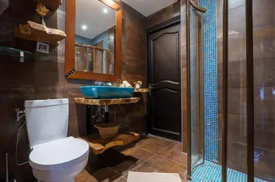 a bathroom with a toilet and a sink at Appartment - Panoramic Sea View - Swimming Pool in Villefranche-sur-Mer