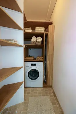 a laundry room with a washer and dryer at Appartment - Panoramic Sea View - Swimming Pool in Villefranche-sur-Mer