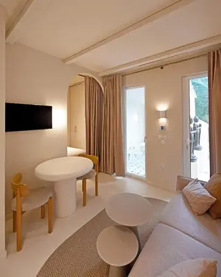 a living room with a couch and a table at Appartement d architecte - wifi, AC, 3 pers in Nice