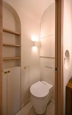 a white bathroom with a toilet and a light at Appartement d architecte - wifi, AC, 3 pers in Nice