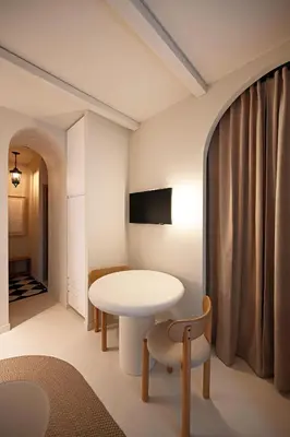 a dining room with a table and a chair at Appartement d architecte - wifi, AC, 3 pers in Nice