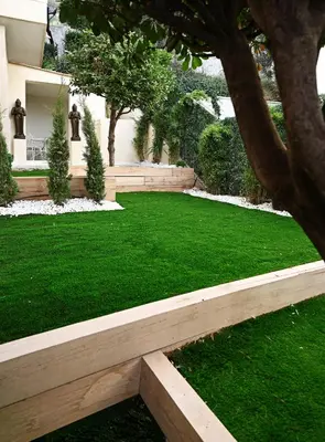 a garden with a green lawn and a building at Appartement d architecte - wifi, AC, 3 pers in Nice