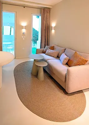 a living room with a couch and a table at Appartement d architecte - wifi, AC, 3 pers in Nice