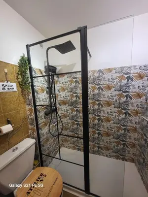 a bathroom with a toilet and a sink and a tub at Studio près de la mer in Cagnes-sur-Mer