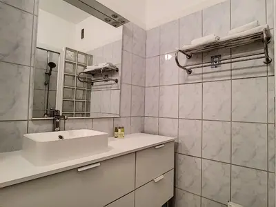 a white bathroom with a sink and a mirror at Nestor&Jeeves - BEETHOVEN - Residential Area - Central in Nice