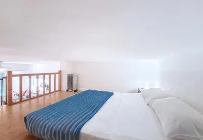 a large white bed in a room with a staircase at Nestor&Jeeves - SQUARE PROMENADE - Central - Close sea in Nice