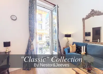 a living room with a blue couch and a mirror at Nestor&Jeeves - PALAIS ALICE - Central - Near Beach in Nice