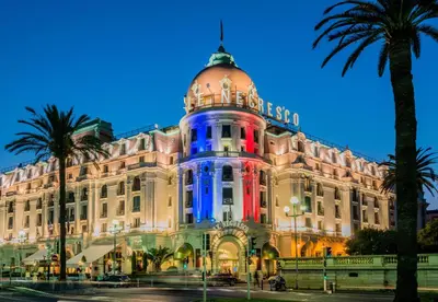 a building with blue and red lights on it at Nestor&Jeeves - PALAIS ALICE - Central - Near Beach in Nice