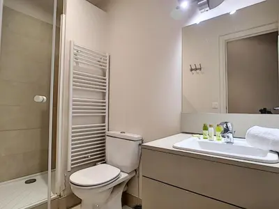 a bathroom with a toilet and a sink and a shower at Nestor&Jeeves - PALAIS ALICE - Central - Near Beach in Nice