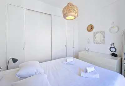 a white bedroom with a bed and a bath tub at Nestor&Jeeves - SWEETHEART - Central location - Close Old Town in Nice
