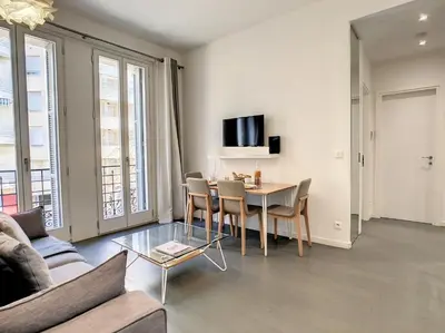 a living room with a table and chairs at Nestor&Jeeves - SWEET BEACH - Central - Near Beach in Nice