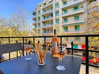 a table with two glasses and a bottle of wine at Nestor&Jeeves - SWEET BEACH - Central - Near Beach in Nice