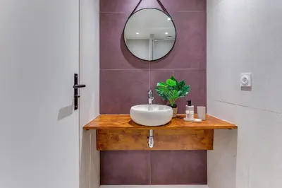 a bathroom with a sink and a mirror at ESCAPADE AP4463 By Riviera Holiday Homes in Villefranche-sur-Mer