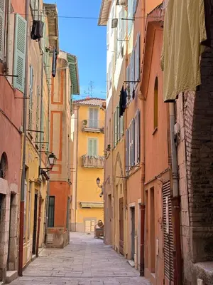 an alley in an old town with buildings at ESCAPADE AP4463 By Riviera Holiday Homes in Villefranche-sur-Mer