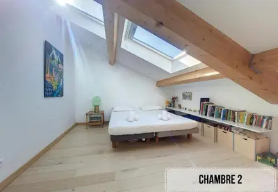 a attic room with a bed and a book shelf at Nestor&Jeeves - NICE TO MEET YOU - Top floor - Central in Nice