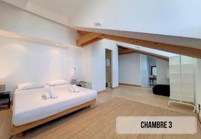 a bedroom with a white bed in a room at Nestor&Jeeves - NICE TO MEET YOU - Top floor - Central in Nice