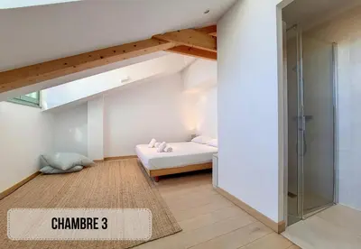 a bedroom with a bed and a glass shower at Nestor&Jeeves - NICE TO MEET YOU - Top floor - Central in Nice