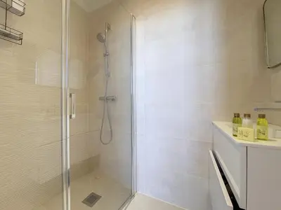 a shower with a glass door in a bathroom at Nestor&Jeeves - NICE TO MEET YOU - Top floor - Central in Nice