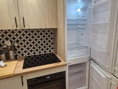 a kitchen with an empty refrigerator with its door open at PASTO DROITE Appartement Nice 6P in Nice