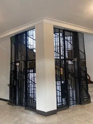 a group of iron gates in a building at La casa in Nice
