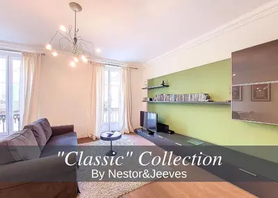 a living room with a couch and a tv at Nestor&Jeeves - CALIFORNIA - Central - Very close sea in Nice