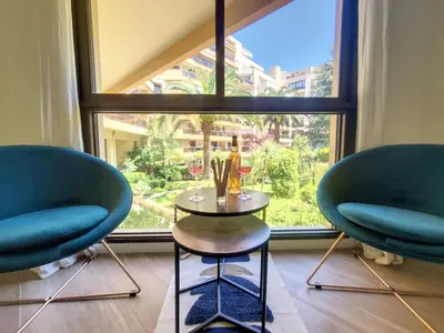 two chairs and a table in front of a window at Nestor&Jeeves - PALM RIVIERA - Central - Close Old Town in Nice