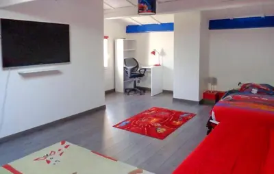 a bedroom with a bed and a desk and a chair at Gorgeous Home In La Gaude in La Gaude