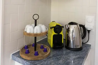 a kitchen counter with a coffee maker and a coffee pot at Breathtaking panoramic view of Nice ! in Nice