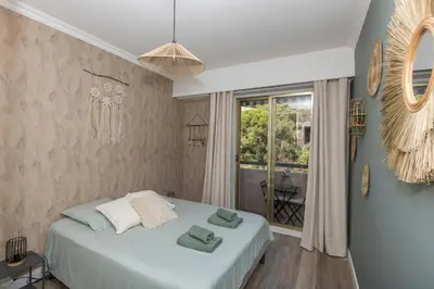 a bedroom with a white bed and a window at Breathtaking panoramic view of Nice ! in Nice