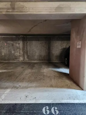 an empty parking garage with a car underneath it at Charmant 2 pièces, centre ville & proche gare in Nice