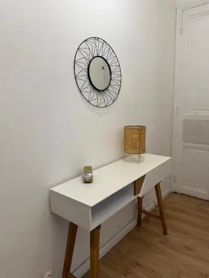 a white table with a mirror on a wall at Deux pièces Libération - Balcon in Nice