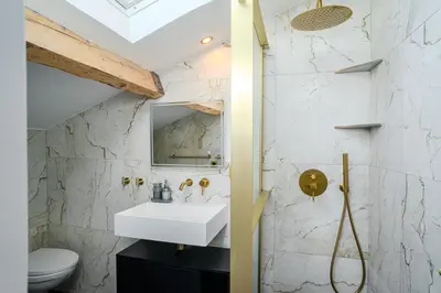 a bathroom with a sink and a mirror at Appartement Original cœur de ville -AC- in Nice