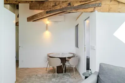 a small dining room with a table and chairs at Appartement Original cœur de ville -AC- in Nice