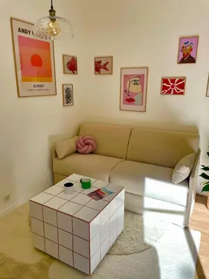 a living room with a couch and a coffee table at Under the Citrus Trees in Nice