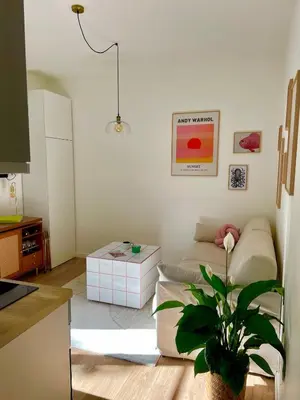 a living room with a couch and a table at Under the Citrus Trees in Nice