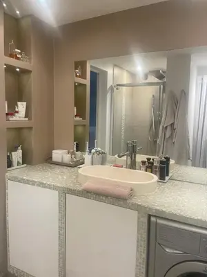 a bathroom counter with a sink and a mirror at Appartment with private garden in city center Nice in Nice