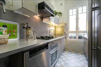 a kitchen with a stainless steel stove top oven at Chambre chez l'habitant - Centre Nice 10 min de la plage in Nice