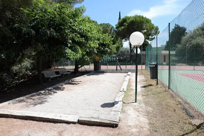 a tennis court with a basketball hoop and a tennis court at Pleine vue mer au calme - Parking, Piscine, Tennis in Nice