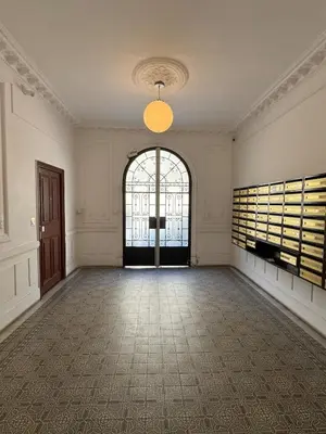 an empty room with a large door and a large window at Large Studio 7 minutes from Beach in Nice