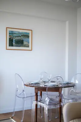 a balcony with a table with food on it at Terrasse ensoleillée sur les toits de Nice in Nice