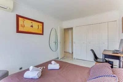 a bedroom with a bed with towels on it at FRANCIA AZUR AP4483 by RIVIERA HOLIDAY HOMES in Nice