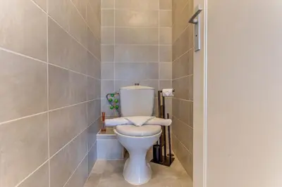 a bathroom with a white toilet in a room at FRANCIA AZUR AP4483 by RIVIERA HOLIDAY HOMES in Nice