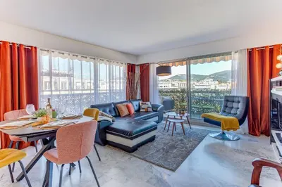 a living room with a couch and a table at FRANCIA AZUR AP4483 by RIVIERA HOLIDAY HOMES in Nice