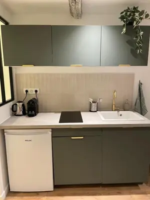 a kitchen with a sink and a counter top at Appartement cosy au coeur du vieux Nice in Nice