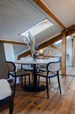 a dining room with a table and chairs at Appart' cosy sur les toits du coeur de Nice - Clim in Nice