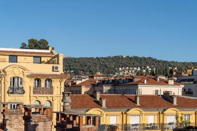 a view of a city with buildings and trees at Appart' cosy sur les toits du coeur de Nice - Clim in Nice