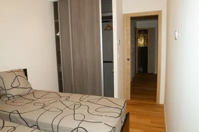 a bedroom with a bed and a hallway at LE PALAIS DIANE - Apt cosy, Moderne et Climatisé in Nice